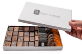 Coffret Découverte assortiment de bonbons chocolat noir et lait, accompagnés d'oranges confites et de notre chocolat signature le Maen-Hir.